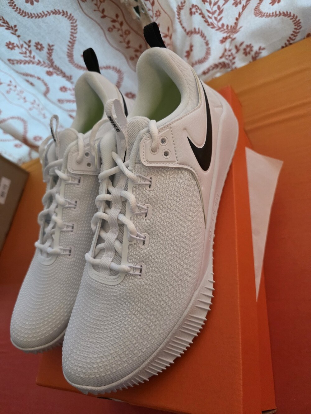 Nike White Low-Top Trainer with Black Swoosh Accent